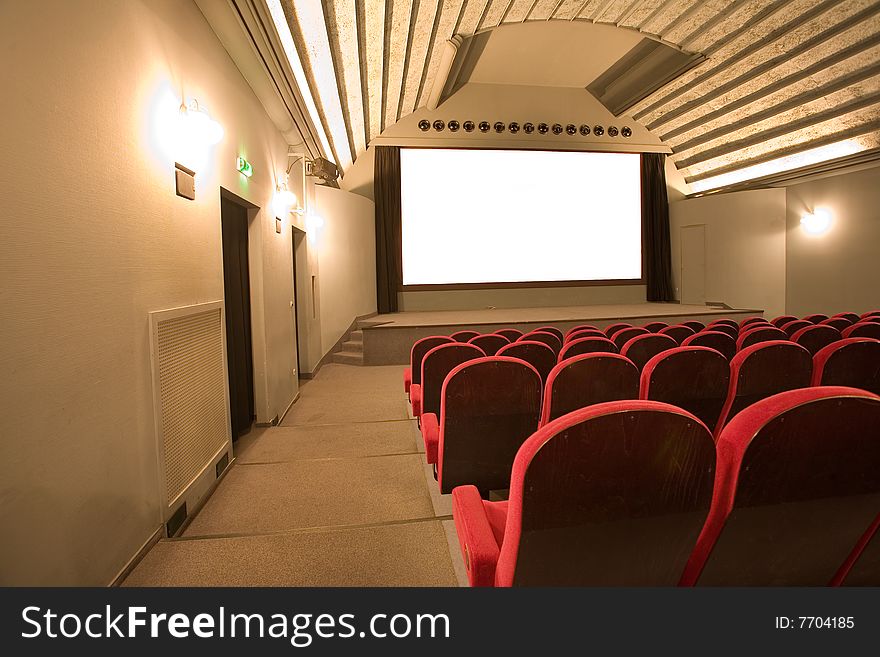 Empty cinema auditorium with chairs