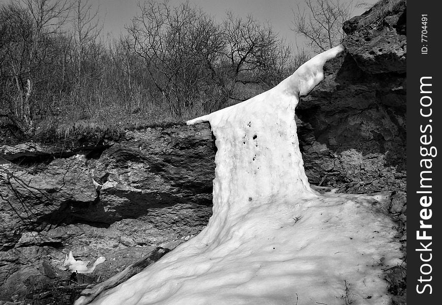 The frozen brook was formed by an icy waterfall