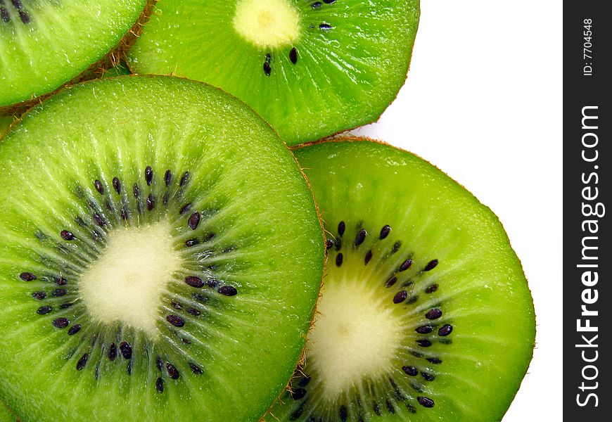 Slices of kiwi on white background