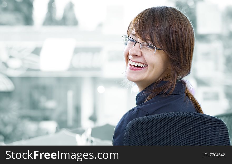 Portrait of young beautiful smiling  girl in office environment. Portrait of young beautiful smiling  girl in office environment