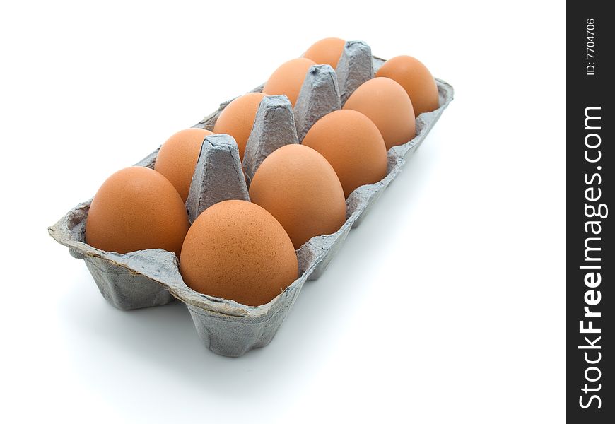 Eggs in a carton on white background