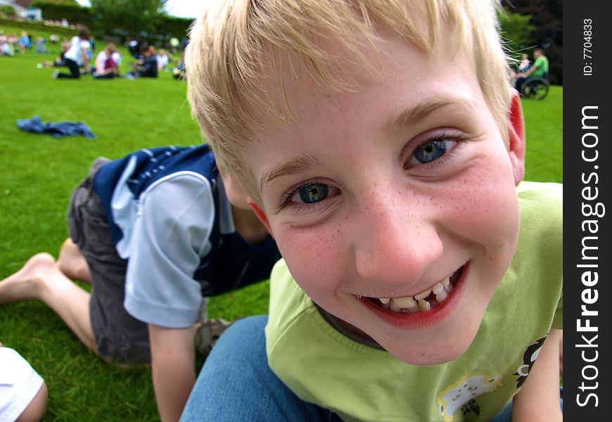 A photograph of a boy playing in summer