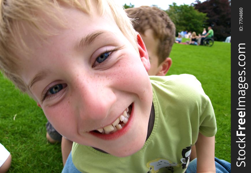 A photograph of a boy playing in summer