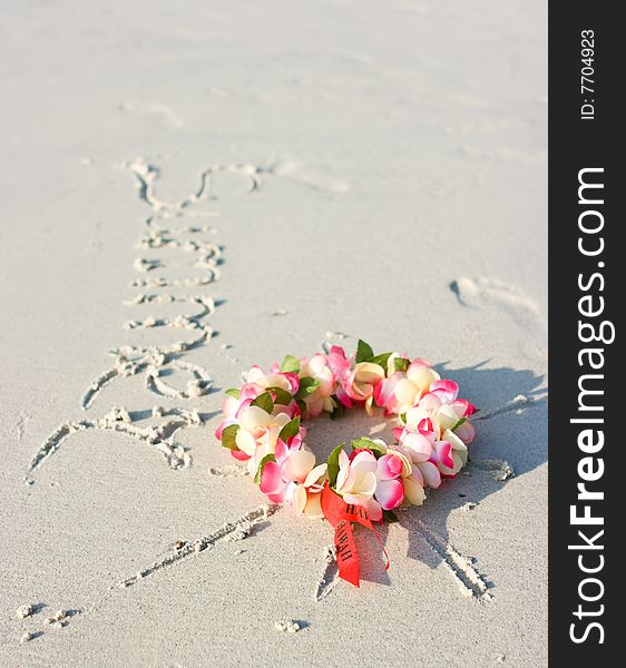 Hawaii flowers lying on the sand like a sun. Hawaii flowers lying on the sand like a sun