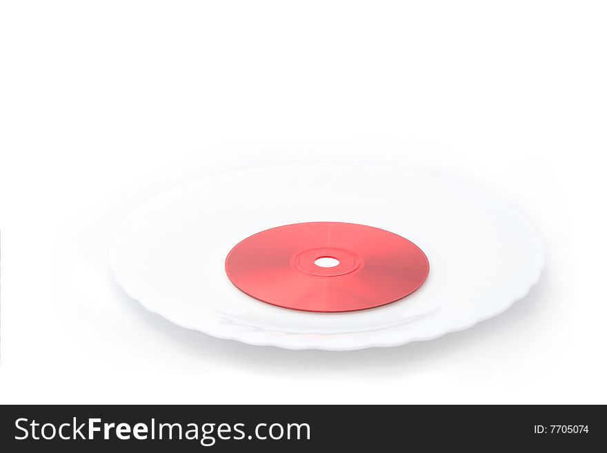 Taste digital content: a red compact disc on isolated white plate (dish)