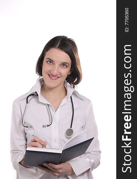 Young doctor with stethoscope  and notebook in wight background
