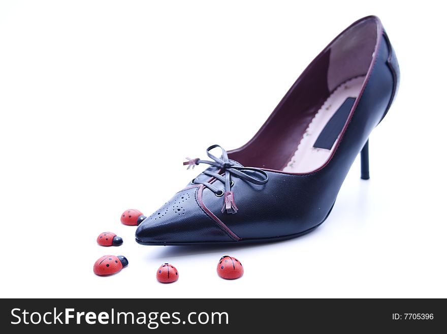 Black leather shoe with ladybird