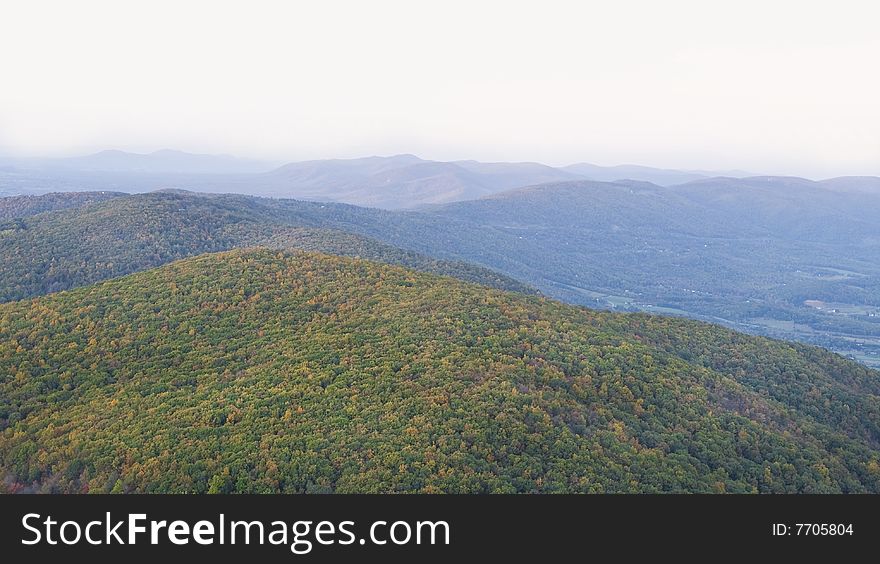 Beautiful and colorful autumn trees and mountain tops. Beautiful and colorful autumn trees and mountain tops.