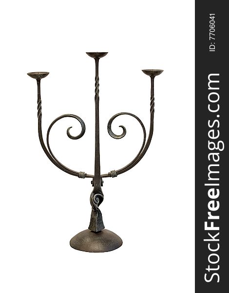 Ancient metal candlestick isolated on a white background.