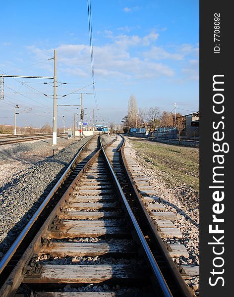 A railway switch and blue sky. A railway switch and blue sky