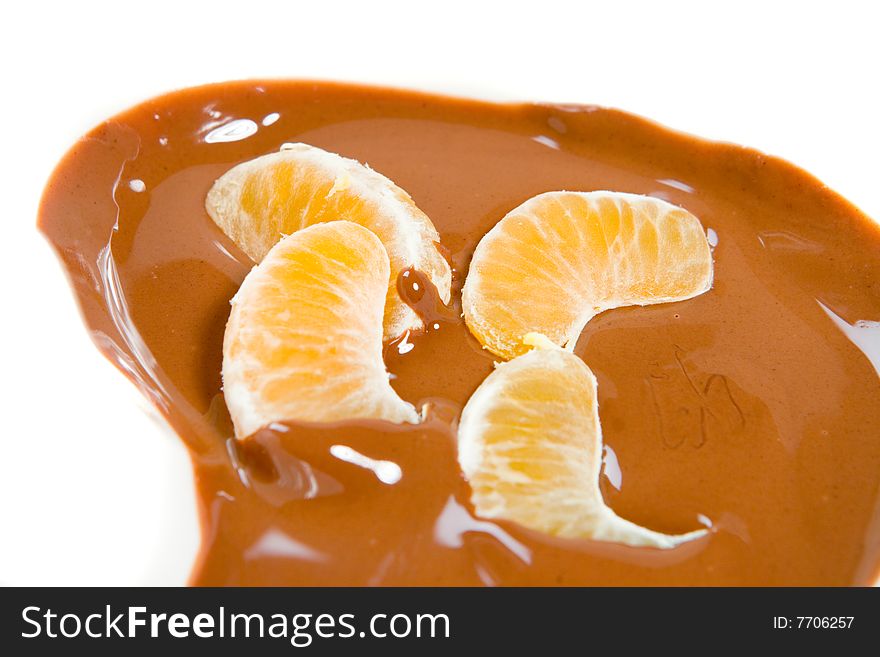 Slice of tangerine in melt chocolate. Slice of tangerine in melt chocolate