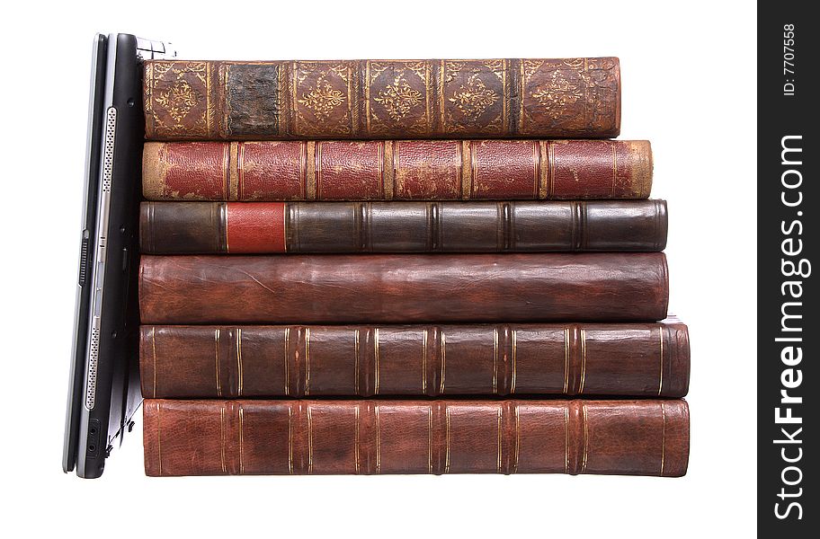 Old leather bound books with a laptop isolated on a white background