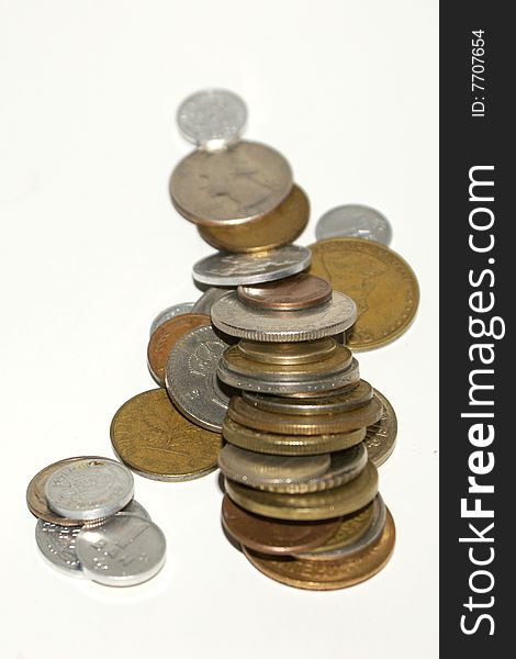 A stack of coins on a white background