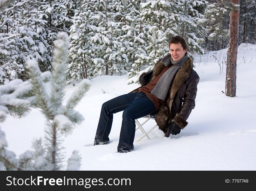 Young handsome man outdoors in winter