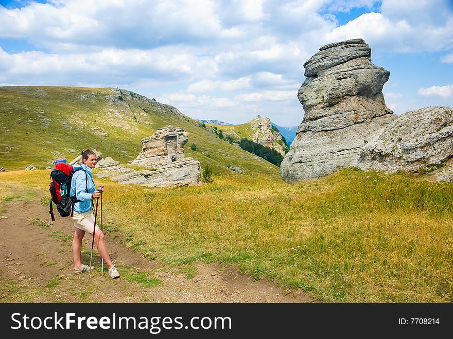 Hiker in mountains. Landmark - Ghost Valley, Demerdji, Crimea, Ukraine. Hiker in mountains. Landmark - Ghost Valley, Demerdji, Crimea, Ukraine.