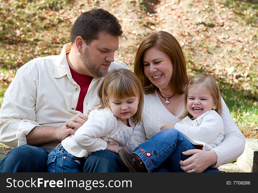 A family enjoying the outdoors on on autumn afternonn. A family enjoying the outdoors on on autumn afternonn