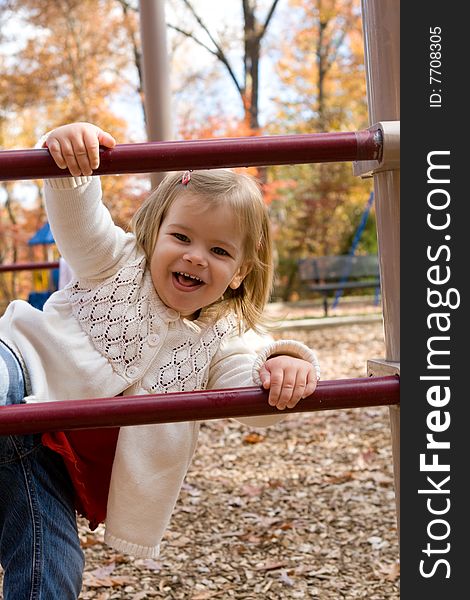 Little girl playing on an autumn day. Little girl playing on an autumn day