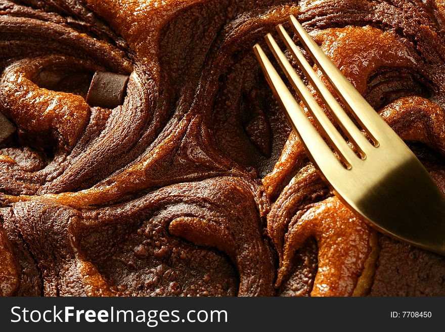 Chocolate cake crop macro texture, golden light, studio shot