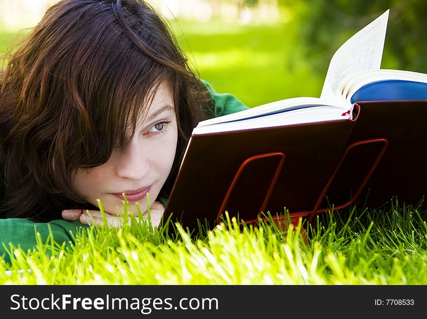 Woman reading on grass