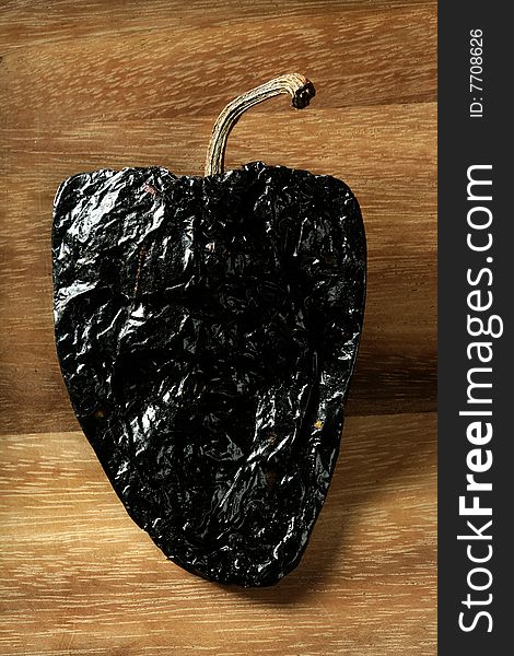 One Black Mexican Dried Chili Pepper Still