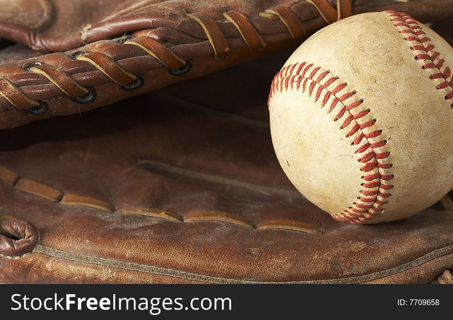 A macro of a baseball in glove. A macro of a baseball in glove