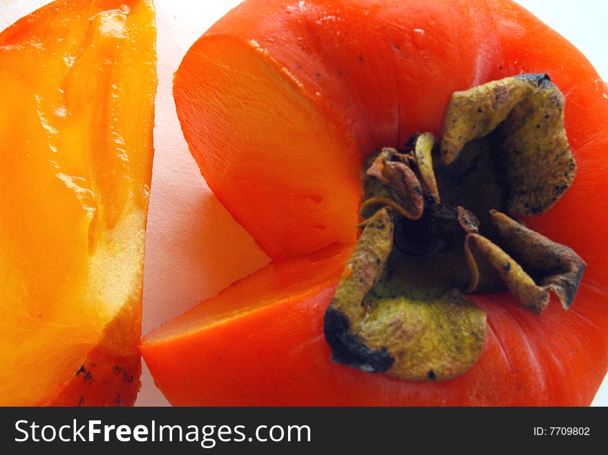 One persimmon on isolated background