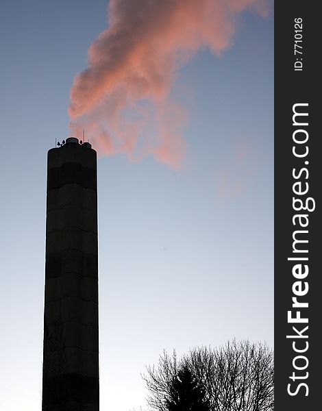 A smoke stack pouring out carbon based fossil fuels. A smoke stack pouring out carbon based fossil fuels