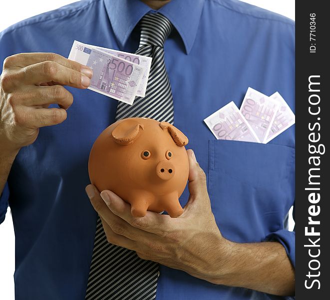 Businessman insert euro notes in clay piggy bank