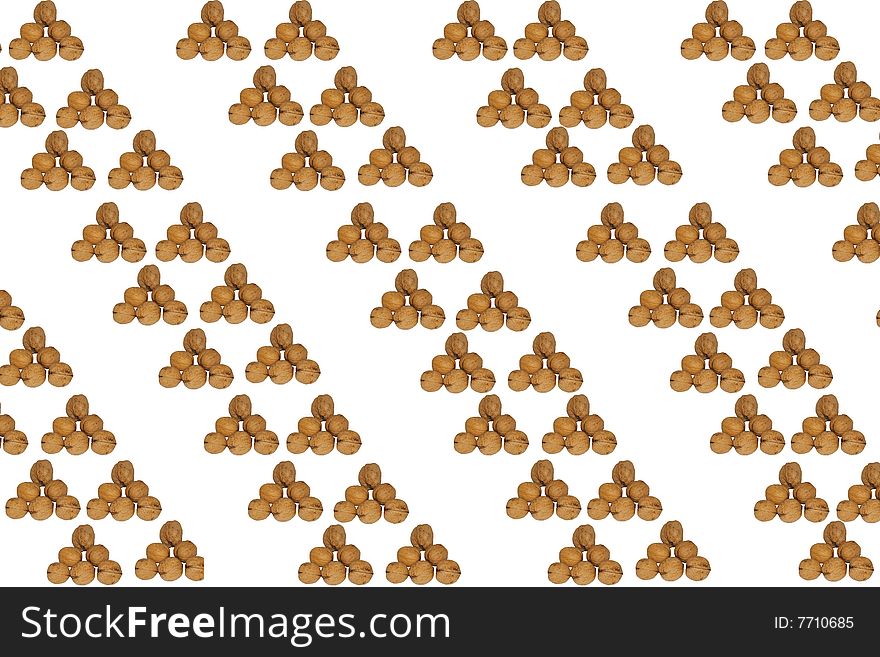 Walnut background made of walnut pyramids