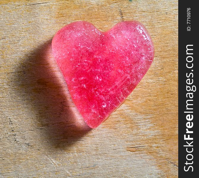 Stock photo: an image of a heart on a wooden background. Stock photo: an image of a heart on a wooden background