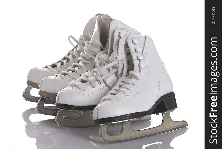 Four figures skates on white and ice background. Four figures skates on white and ice background