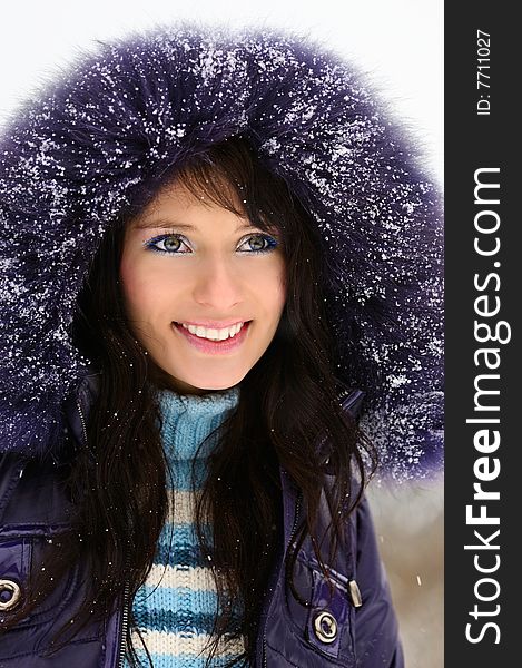 Portrait of a beautiful girl in snowy winter. Portrait of a beautiful girl in snowy winter.