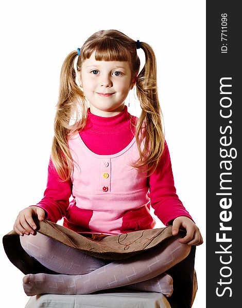 Stock photo: an image of a smiling girl on a chair. Stock photo: an image of a smiling girl on a chair