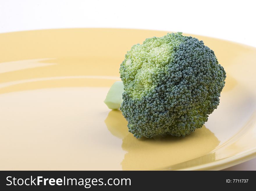 Broccoli on a yellow plate. Broccoli on a yellow plate