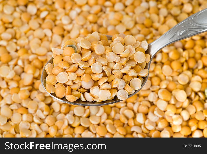 Closeup of dried peas on spoon