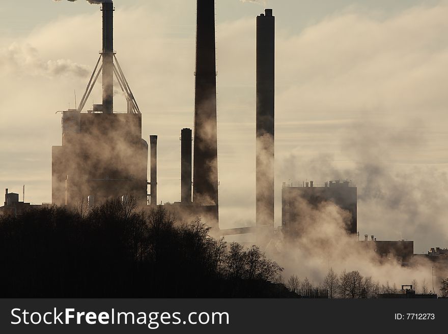 Smoke stack coming from a manufacturing plant. Smoke stack coming from a manufacturing plant