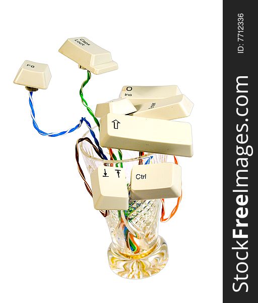 Instalation in wineglass set of old keyboard buttons and colored wire. Instalation in wineglass set of old keyboard buttons and colored wire