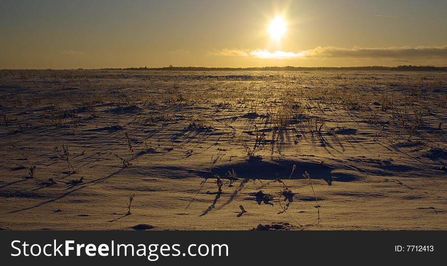 Winter landscape with sunset over snow field. Winter landscape with sunset over snow field