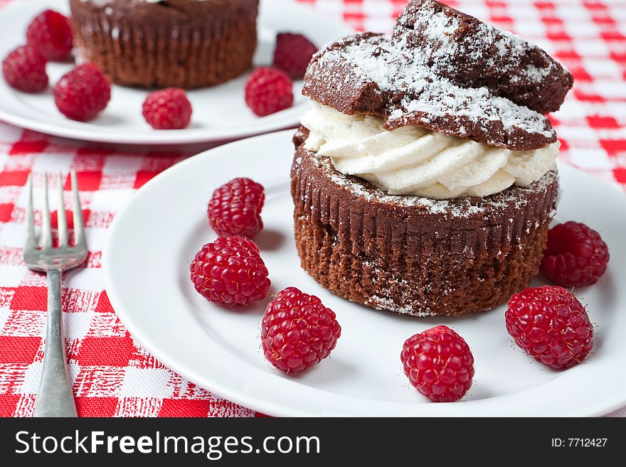 Delicious chocolate and cream muffins on a plate