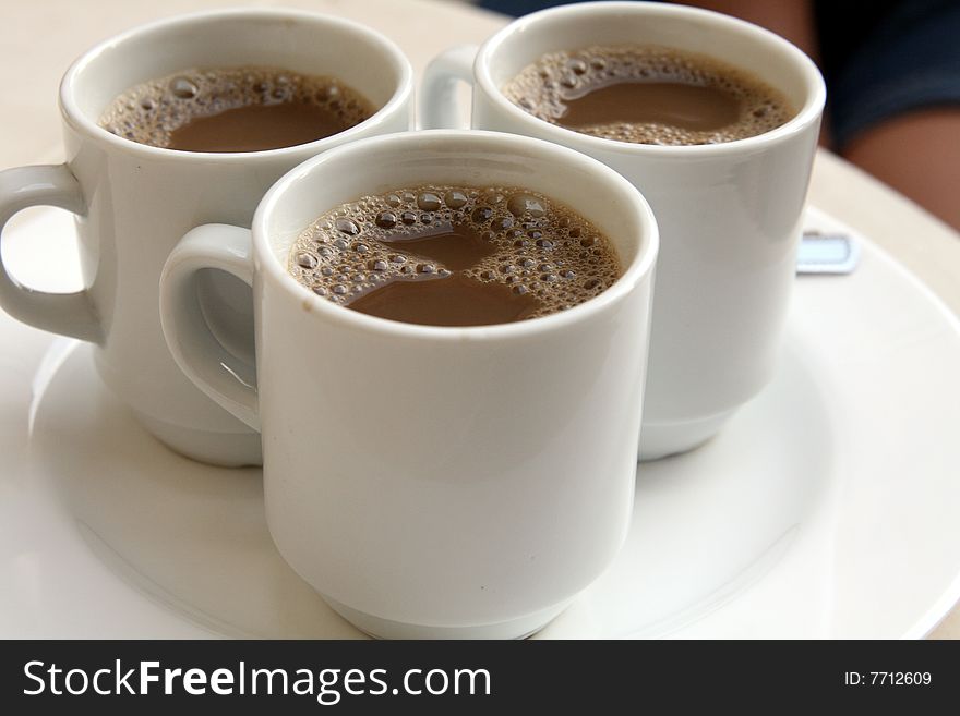 Three cups of coffee on the table