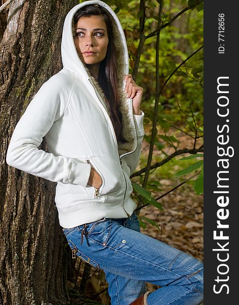 Young woman on autumn forest under chestnut tree. Young woman on autumn forest under chestnut tree