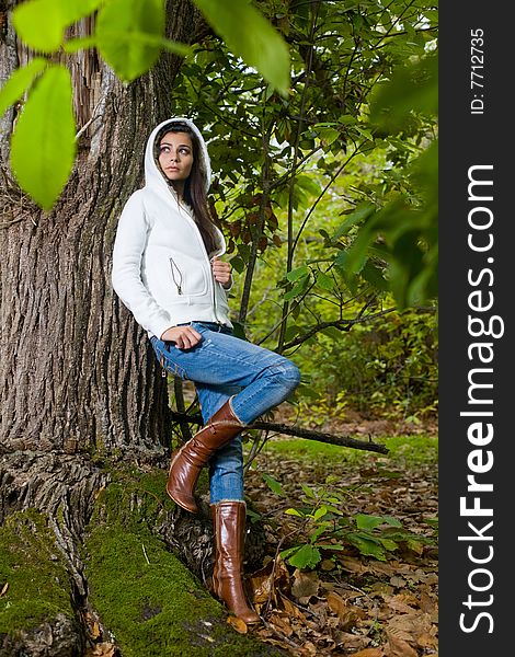 Young woman on autumn forest under chestnut tree. Young woman on autumn forest under chestnut tree