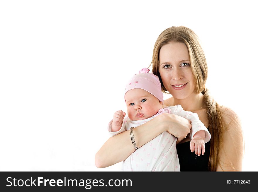 Happy mother  holding a young baby girl