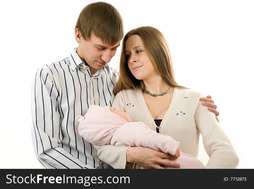 Happy mother and father holding a young baby girl. Isolated on white background. Happy mother and father holding a young baby girl. Isolated on white background.