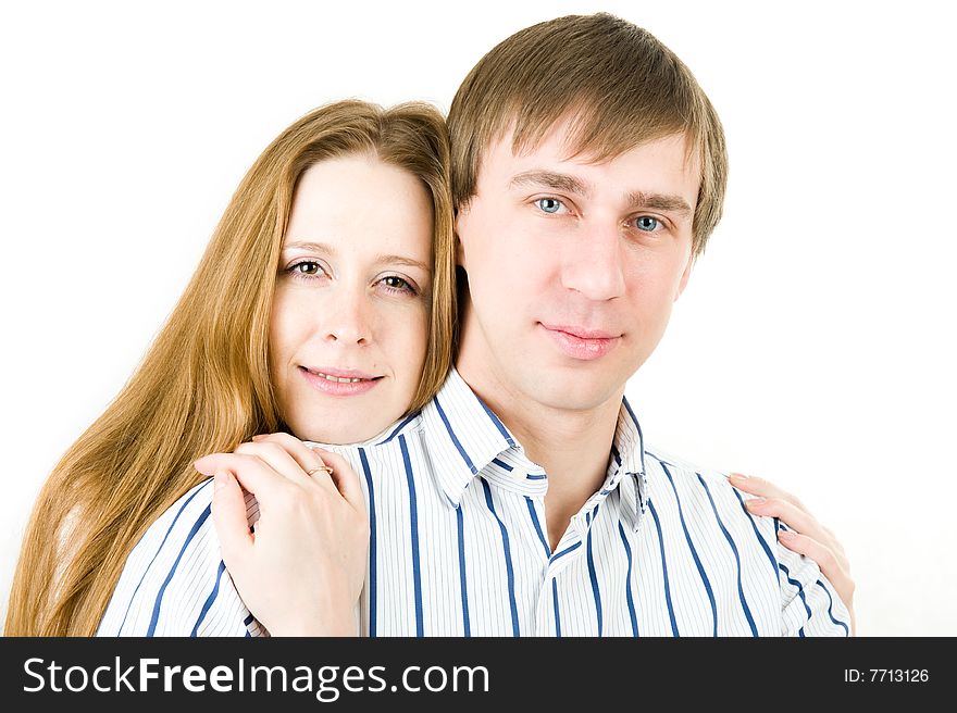 Closeup portrait of pretty couple. Isolated on white background