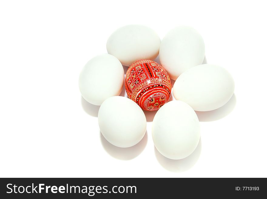 Easter egg among white eggs over white