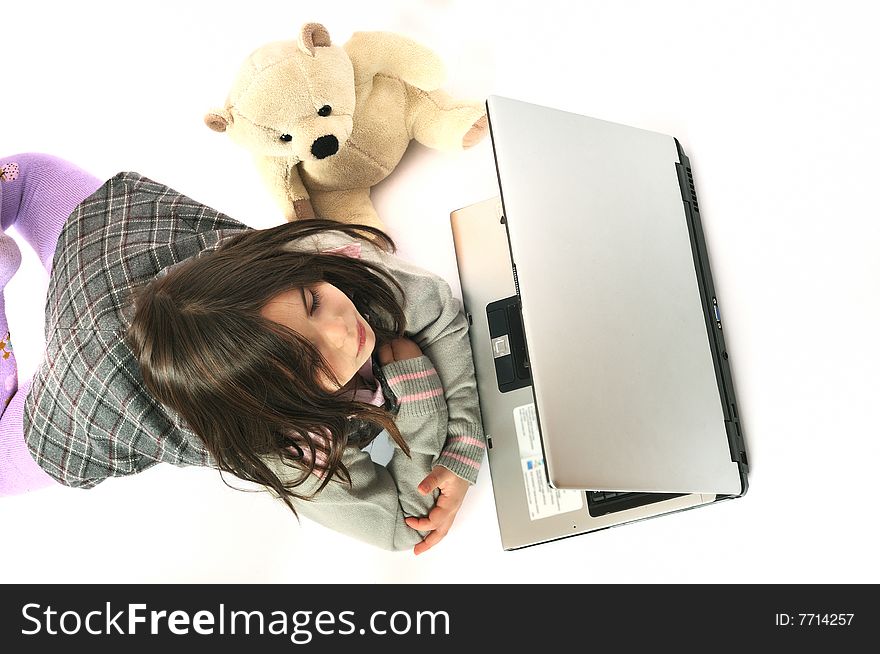 Child with laptop on white background