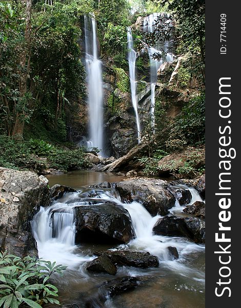 The waterfall in forest on winter season