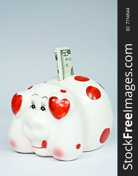 Porcelain piggy bank isolated on grey