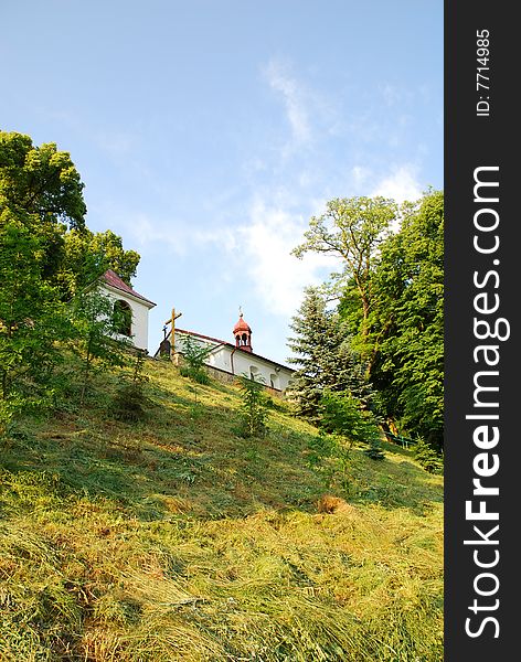 Old church and green meadow